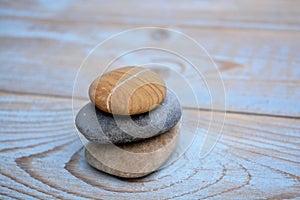Three zen stones on old wood