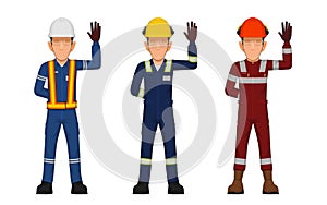 Threes industrial workers are raising hand sign stop
