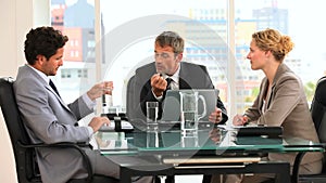 Threesome of business people during a meeting