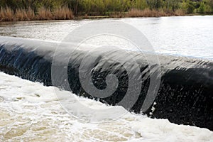 Threshold of a mountain river, canal, a small waterfall
