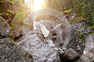 Thresholds and waterfall of mountain river