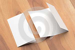 Thrifold - Three fold brochure mock up on wooden background. 3d