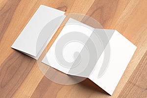 Thrifold - Three fold brochure mock up on wooden background. 3d