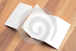 Thrifold - Three fold brochure mock up on wooden background. 3d