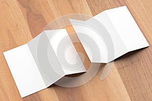 Thrifold - Three fold brochure mock up on wooden background. 3d