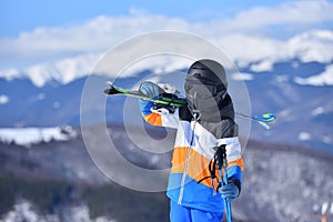 The Thrill of the Climb - Boy Ascends the Slopes on Foot for an Unforgettable Ski Experience