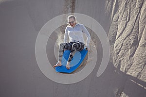Thrill seeking woman Playing in the Sand Dunes Outdoor Lifestyle