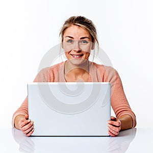 Thrilled beautiful blond girl with computer, fun and wellbeing