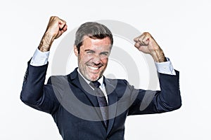Thrilled corporate man with elegant suit for success and joy photo