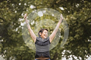 Thrilled and joyful mature businesswoman jumping