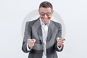 Thrilled male manager pointing his fingers to show his satisfaction photo