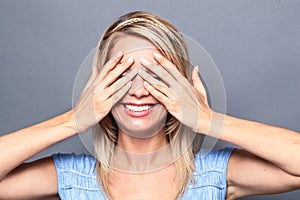 Thrilled young blond woman expressing surprise photo