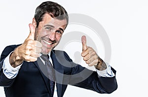 Thrilled smart young businessman with thumbs up approving corporate wellbeing photo