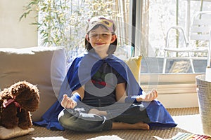 Thrilled superhero lockdown home child enjoying gratitude from fun mindfulness