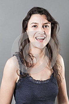 Thrilled woman with smiling expressing happiness and wellbeing photo