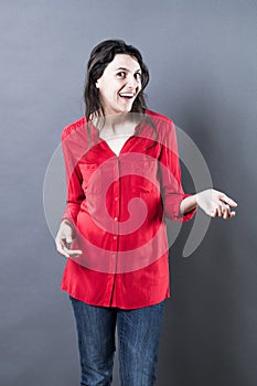 Thrilled young woman expressing positive amazement