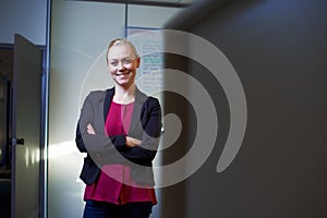 Thriving in the business world. Portrait of an attractive businesswoman standing with her arms crossed in the office.