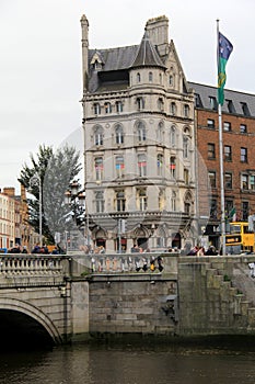 Throngs of people crossing famous OConnell Bridge, in the heart of the city,Dublin,Ireland,October,2014