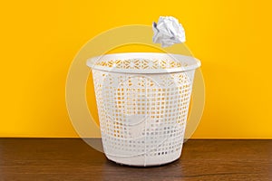 Throw it in the waste paper basket or bin concept for business frustration, stress and writers block
