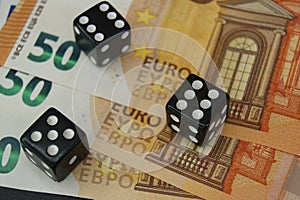 Throwable dice on 50 euro banknotes. Gambling.