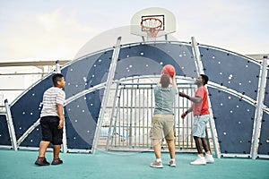 Throwing Ball Into Basketball Hoop