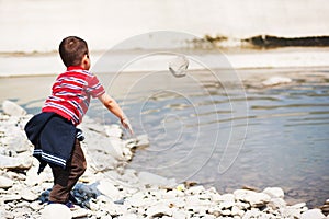 Throwing rock in water