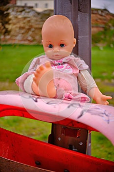 Thrown out baby doll toy