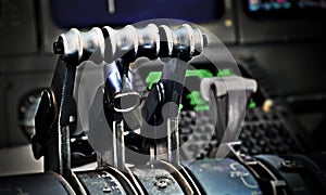Thrust levers in an old airplane`s cockpit
