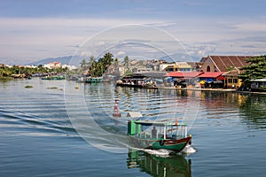 Thu bon river and boat in citycentre of Hoi An