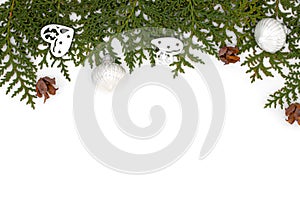 Thuja and pine branches with christmas toys on white background, festive composition top view, flat lay