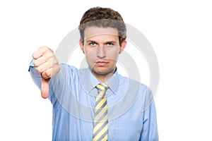 Thumb down, young businessman, isolated