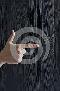 Thumb and indexfinger pointing in direction