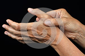 A thumb pain on a black background photo