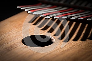 Thumb piano Kalimba, Mbira with silver and red tines