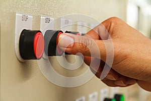 Thumb touch on red stop switch