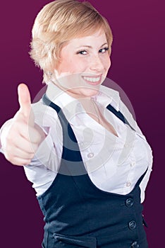 Thumb up & blond beautiful young woman smiling