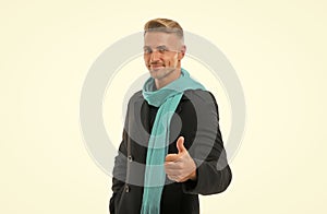 thumb up for success. handsome male has groomed graying hair. mature guy isolated on white background. autumn casual