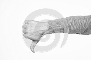 Thumbs down. dislike or unlike gesture. denote something bad. male hand with thumb down.