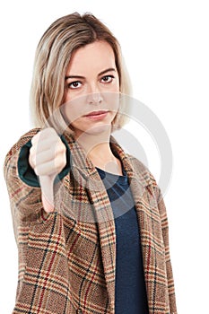 Thumbs down, fail and portrait of woman in studio isolated on white background. Face, dislike hand gesture and sad
