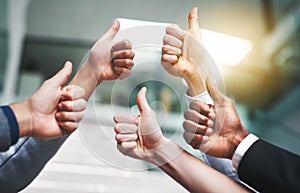 Thumbs up, agreement and hands with like of business people in office for success, yes and teamwork. Emoji, support and