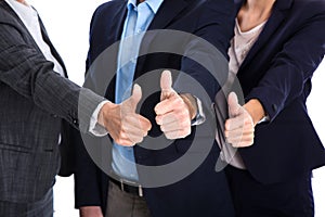 Thumbs up: business people making symbol for success, yes or par