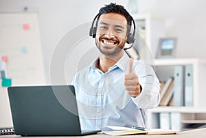 Thumbs up, call center and customer service with a man saying thank you and working in sales or telemarketing. Crm