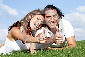 Thumbs-up couple photo