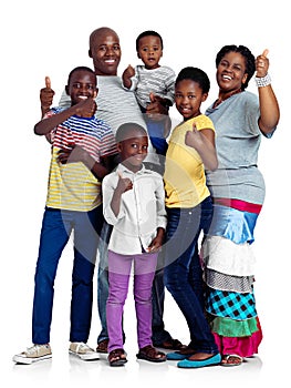 Thumbs up for family. Studio shot of an african family giving thumbs up signs, isolated on white.