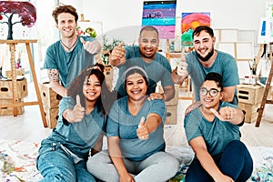 Thumbs up for a good art class. Cropped portrait of a diverse group of friends posing together and showing a thumbs up