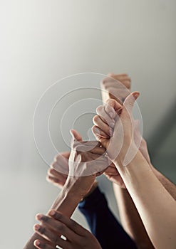 Thumbs up, hands and team together in office for collaboration or teamwork with success or yes sign. People, business