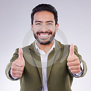 Thumbs up, successful and portrait of businessman happy and smile for success isolated in a studio white background