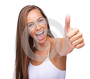 Thumbs up, winner and portrait of a woman with yes isolated on a studio background. Success, smile and model with a hand