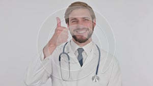 Thumbs Up by Young Doctor on White Background