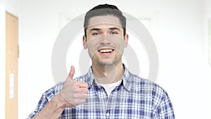 Thumbs Up by Young Man photo